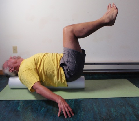 John Hughes demonstrating roller bent two leg raise exercise for core strength training for cyclists