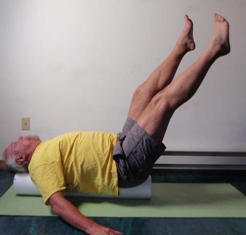 Coach John Hughes demonstrating Pilates circles exercise for core strength training for cycling