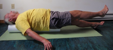 John Hughes demonstrating straight leg raise exercise for core strength training for cyclists 