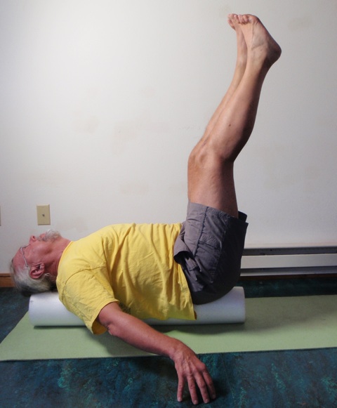 Coach John Hughes demonstrating straight two leg balance exercise for core strength training for cyclists