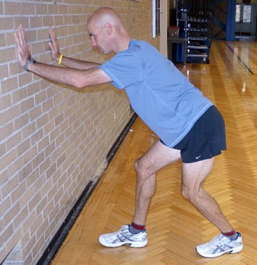 Dan Kehlenbach demonstrating the soleus stretch for bicycle riders