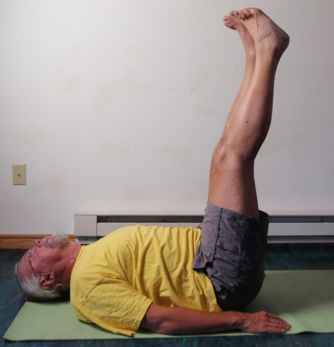 Coach John Hughes demonstrating straight two leg balance exercise for core training for cyclists