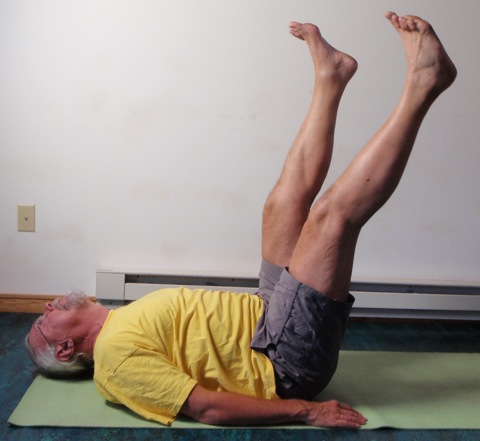 Coach John Hughes demonstrating straight two leg balance exercise for core training for cycling