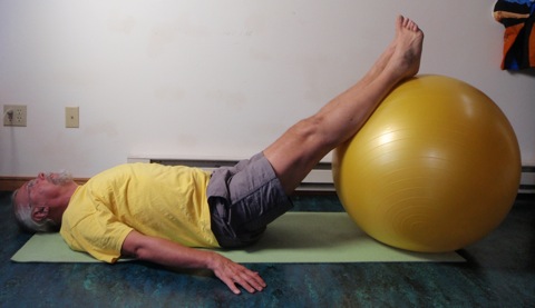 John Hughes demonstrating exercise ball for core training for cyclists 