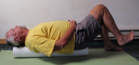  John Hughes demonstrating the roller bent leg strength exercise for core training for cyclists.