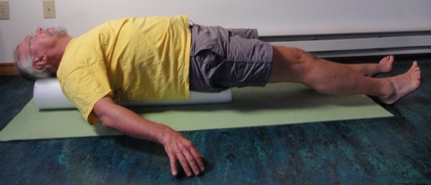 John Hughes demonstrating straight leg raise exercise for core strength training for cyclists